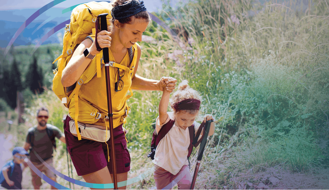 Parent helping a child on a mountain hike, symbolising how medical cover can strengthen your financial safety net and protect long-term wealth.